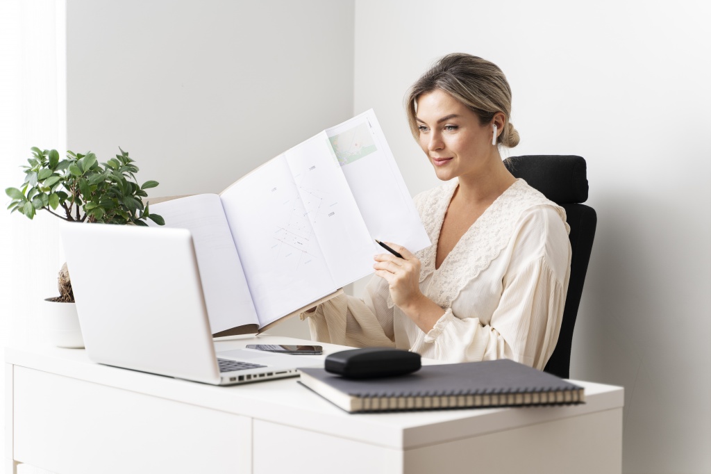 medium-shot-woman-sitting-desk (1).jpg